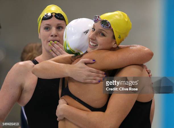 Emily Seebohm, Libby Trickett and Brittany Elmslie of Australia celebrate after they finished first in heat two of the Women's 4x100m Freestyle Relay...