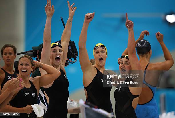 Libby Trickett, Emily Seebohm, Brittany Elmslie and Yolane Kuklaof Australia celebrate after they finished first in heat two of the Women's 4x100m...
