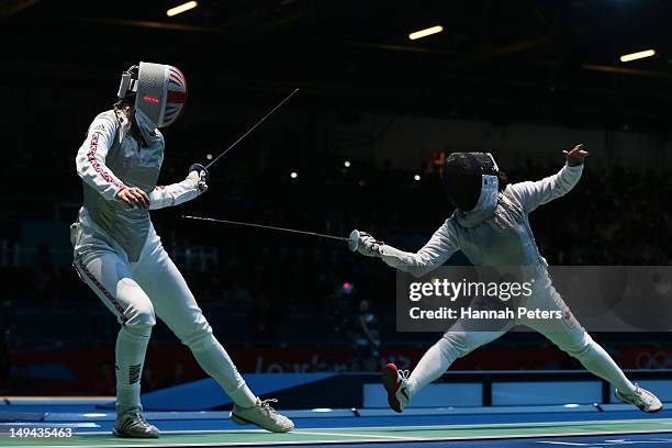 Monica Peterson of Canada competes with Anna Bentley of Great Britain in their Women's Foil Individual Round of 64 match on day one of the London...