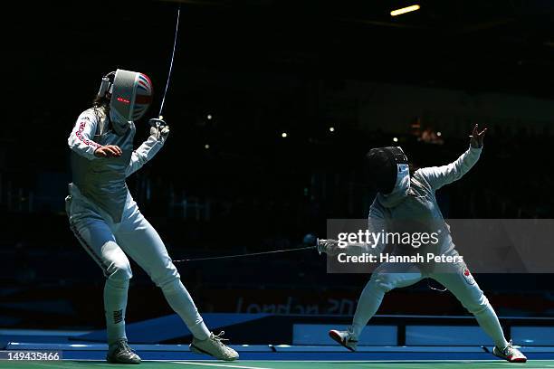 Monica Peterson of Canada competes with Anna Bentley of Great Britain in their Women's Foil Individual Round of 64 match on day one of the London...