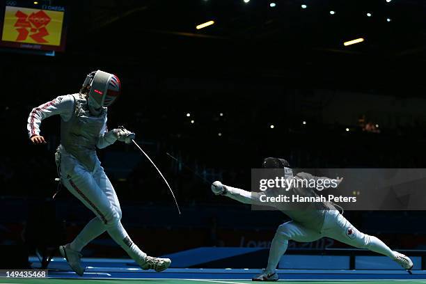Monica Peterson of Canada competes with Anna Bentley of Great Britain in their Women's Foil Individual Round of 64 match on day one of the London...
