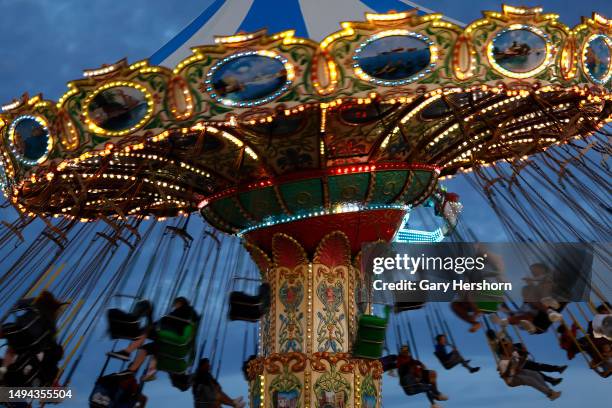 People enjoy an amusement park ride on Memorial Day weekend as the sun sets on May 28 in Seaside Heights, New Jersey.