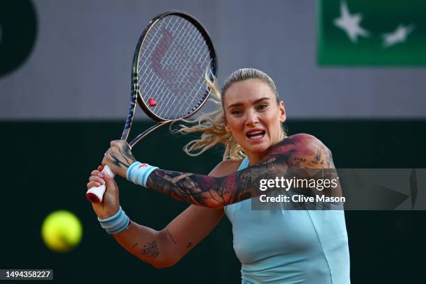 Tereza Martincova of Czech Republic plays a backhand against Jelena Ostapenko of Latvia during their Women's Singles First Round Match on Day Two of...