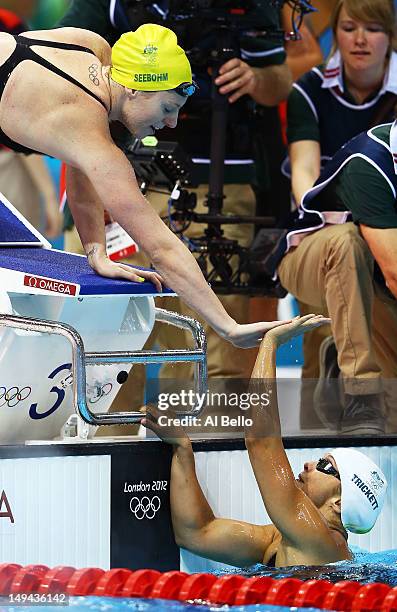 Emily Seebohm and Libby Trickett of Australia celebrate after they finished first in heat two of the Women's 4x100m Freestyle Relay on Day One of the...