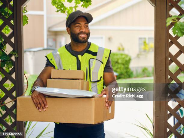 package delivery person - postal worker stock pictures, royalty-free photos & images