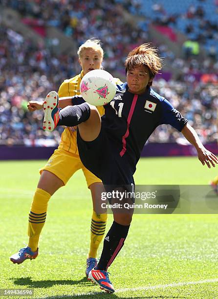 Shinobu Ohno of Japan passes the ball during the Women's Football first round Group F Match of the London 2012 Olympic Games between Japan and Sweden...