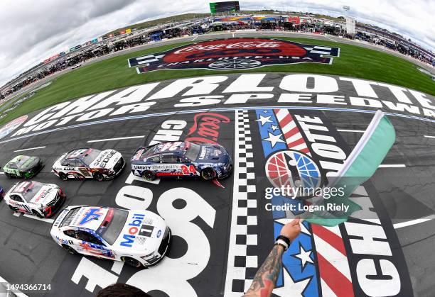 William Byron, driver of the Liberty University Patriotic Chevrolet, leads the field to the green flag to start the NASCAR Cup Series Coca-Cola 600...