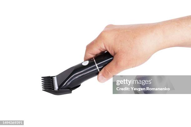 electric hair clipper in hand isolated on white background - shave barber stock pictures, royalty-free photos & images