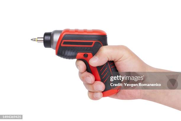 electric screwdriver in hand isolated on white background - screwdriver stock pictures, royalty-free photos & images