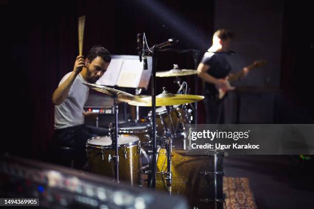 musician plays drum on stage - drummer stock pictures, royalty-free photos & images