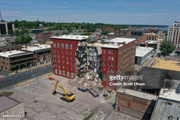 An aerial view shows a portion of a six-story apartment building after yesterday's collapse on May 29, 2023 in Davenport, Iowa. Eight people were...