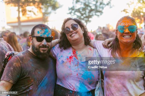 friends enjoying a holi party - body shape stock pictures, royalty-free photos & images
