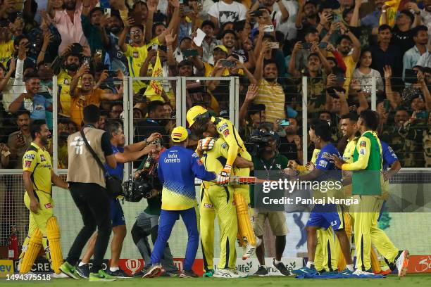 Dhoni and Ravindra Jadeja of the Chennai Super Kings celebrate after winning the 2023 IPL Final match between Chennai Super Kings and Gujarat Titans...