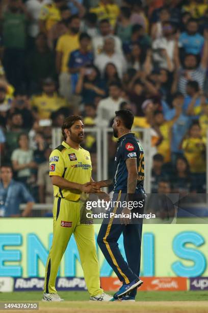 Dhoni of the Chennai Super Kings shakes hands with Hardik Pandya of the Gujarat Titans after winning the 2023 IPL Final match between Chennai Super...
