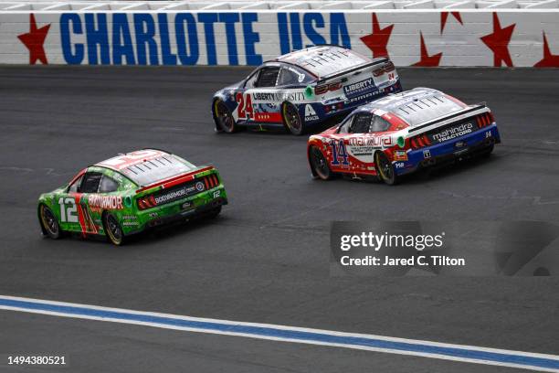 Ryan Blaney, driver of the BodyArmor Cherry Lime Ford, William Byron, driver of the Liberty University Patriotic Chevrolet, and Chase Briscoe, driver...