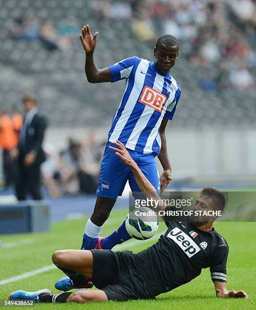 Berlin's Colombish striker Adrian Ramos Turin's defender Michele Pazienza challenge for the ball during a friendly footbal match Hertha BSC Berlin vs...