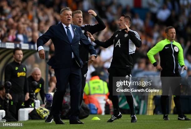 Sam Allardyce, Manager of Leeds United, reacts alongside assistant coaches Karl Robinson and Robbie Keane during the Premier League match between...