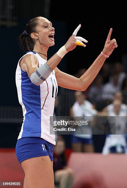 Ekaterina Gamova of Russia celebrates a point against Great Britain during Women's Volleyball on Day 1 of the London 2012 Olympic Games at Earls...