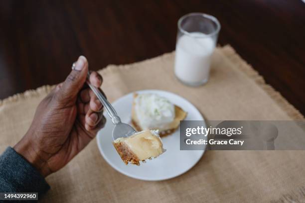 woman eats slice of key lime pie - key lime pie stock pictures, royalty-free photos & images