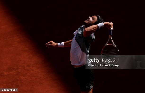 Cameron Norrie of Great Britain serves against Benoit Paire of France during their Men's Singles First Round Match on Day Two of the 2023 French Open...