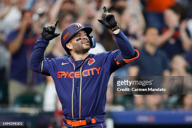 Jose Altuve of the Houston Astros hits a grand slam during the seventh inning against the Minnesota Twins at Minute Maid Park on May 29, 2023 in...