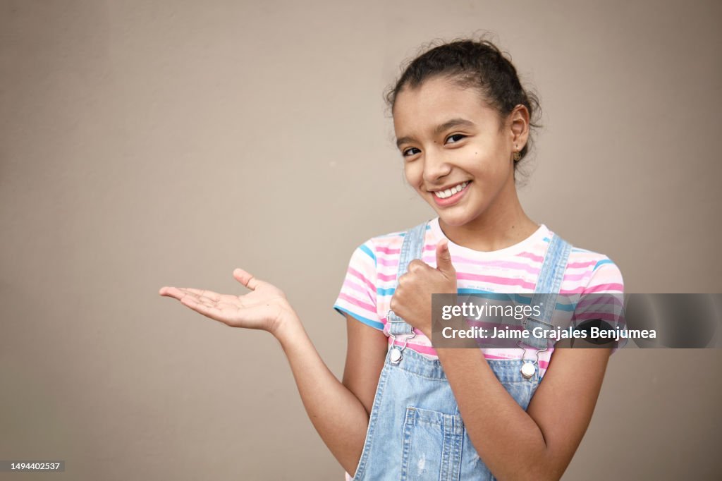 Girl with open outstretched hand with positive attitude