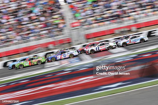 Ryan Blaney, driver of the BodyArmor Cherry Lime Ford, Chase Elliott, driver of the NAPA Patriotic Chevrolet, Denny Hamlin, driver of the Sport Clips...