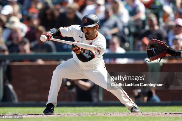 LaMonte Wade Jr. #31 of the San Francisco Giants bunts in the bottom of the seventh inning against the Pittsburgh Pirates at Oracle Park on May 29,...
