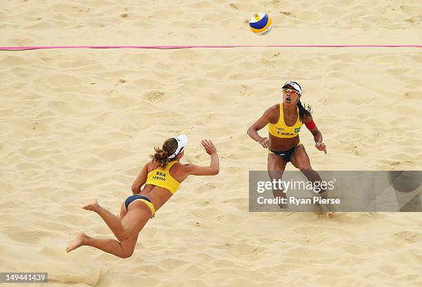 Larissa Franca of Brazil dives for the ball as Juliana Silva is in action during the Women's Beach Volleyball Preliminary Round on Day 1 of the...