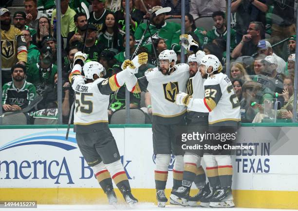 William Carrier of the Vegas Golden Knights celebrates with teammates after scoring a goal during the first period against the Dallas Stars in Game...