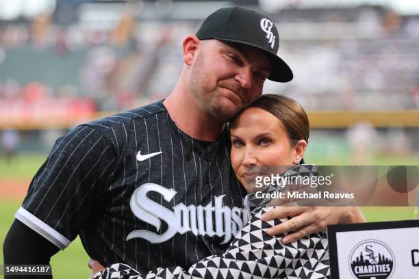 Liam Hendriks of the Chicago White Sox hugs his wife, Kristi Hendriks, prior to the game against the Los Angeles Angels at Guaranteed Rate Field on...
