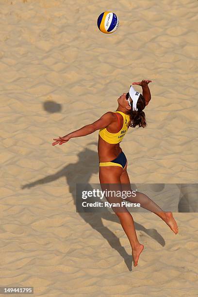 Larissa Franca of Brazil spikes the ball during the Women's Beach Volleyball Preliminary Round on Day 1 of the London 2012 Olympic Games at Horse...