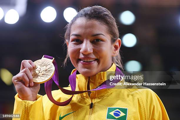 Sarah Menezes of Brazil celebrates winning the gold medal in the Women's -48 kg Judo on Day 1 of the London 2012 Olympic Games at ExCeL on July 28,...