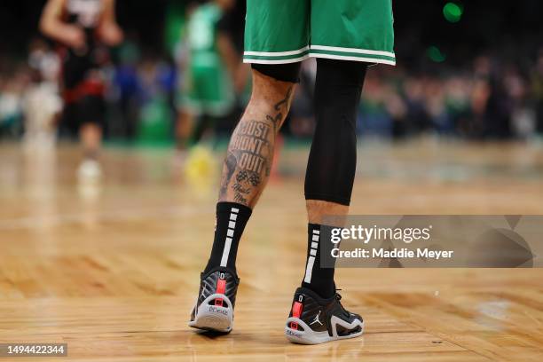 Detail of the tattoos and shoes of Jayson Tatum of the Boston Celtics in game seven of the Eastern Conference Finals between the Miami Heat and the...