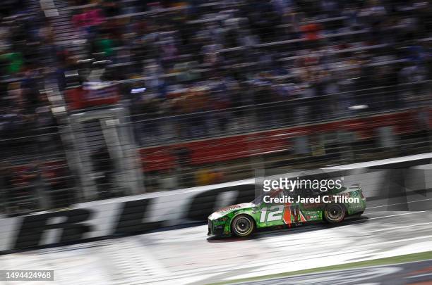 Ryan Blaney, driver of the BodyArmor Cherry Lime Ford, crosses the finish line to win the NASCAR Cup Series Coca-Cola 600 at Charlotte Motor Speedway...