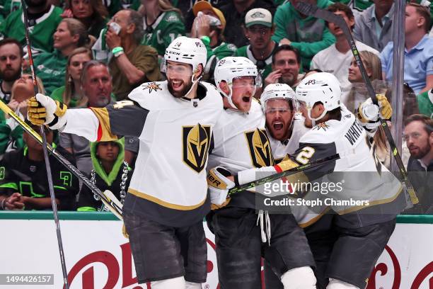 Jonathan Marchessault of the Vegas Golden Knights celebrates with teammates after scoring a goal during the second period against the Dallas Stars in...