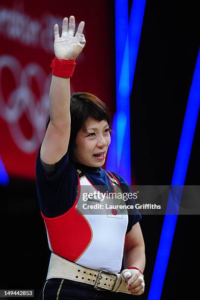 Hiromi Miyake of Japan celebrates after a lift in the Women's 48kg Group A weightlifting on Day 1 of the London 2012 Olympic Games at ExCeL on July...