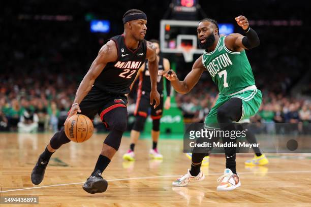 Jimmy Butler of the Miami Heat dribbles against Jaylen Brown of the Boston Celtics during the third quarter in game seven of the Eastern Conference...