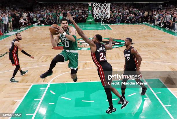 Jayson Tatum of the Boston Celtics drives to the basket against Haywood Highsmith of the Miami Heat during the second quarter in game seven of the...