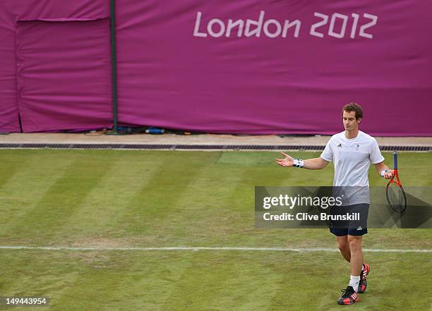 Andy Murray reacts while playing with his brother, Jamie Murray of Great Britain against Alexander Peya and Jurgen Melzer of Austria during their...