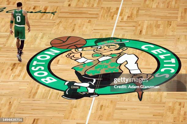 Jayson Tatum of the Boston Celtics walks on the court during the third quarter against the Miami Heat in game seven of the Eastern Conference Finals...