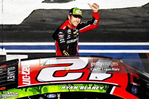 Ryan Blaney, driver of the BodyArmor Cherry Lime Ford, celebrates after winning the NASCAR Cup Series Coca-Cola 600 at Charlotte Motor Speedway on...