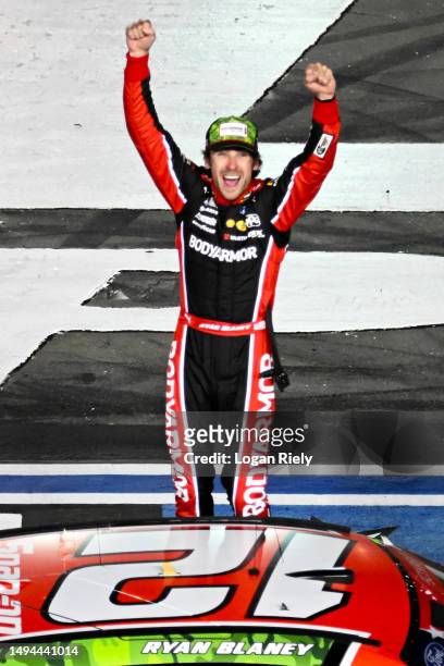 Ryan Blaney, driver of the BodyArmor Cherry Lime Ford, celebrates after winning the NASCAR Cup Series Coca-Cola 600 at Charlotte Motor Speedway on...