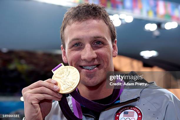 Ryan Lochte of the United States celebrates with his Gold Medal during the Medal Ceremony for the Men's 400m Individual Medley on Day 1 of the London...
