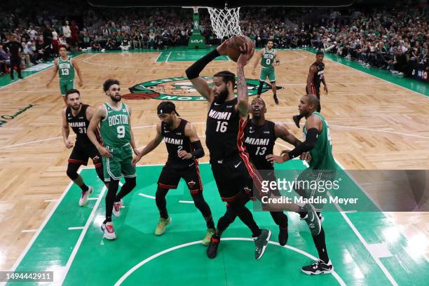Caleb Martin of the Miami Heat rebounds the ball during the first quarter against the Boston Celtics in game seven of the Eastern Conference Finals...