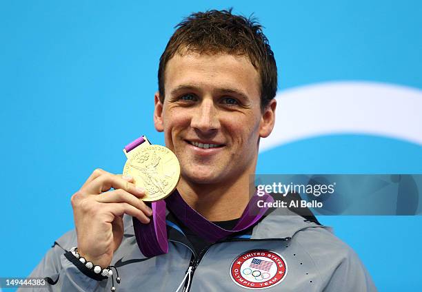 Ryan Lochte of the United States celebrates with his Gold Medal during the Medal Ceremony for the Men's 400m Individual Medley on Day 1 of the London...