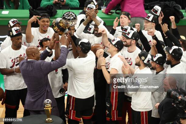 The Miami Heat celebrate with the Bob Cousy Trophy after defeating the Boston Celtics 103-84 in game seven of the Eastern Conference Finals at TD...