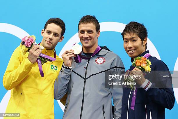 Silver medalist Thiago Pereira of Brazil, Gold medalist Ryan Lochte of the United States and Bronze medalist Kosuke Hagino of Japan celebrate with...