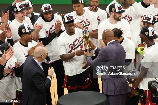 Alonzo Mourning presents Jimmy Butler of the Miami Heat with the Larry Bird Trophy after Butler was named the Eastern Conference Finals MVP after...
