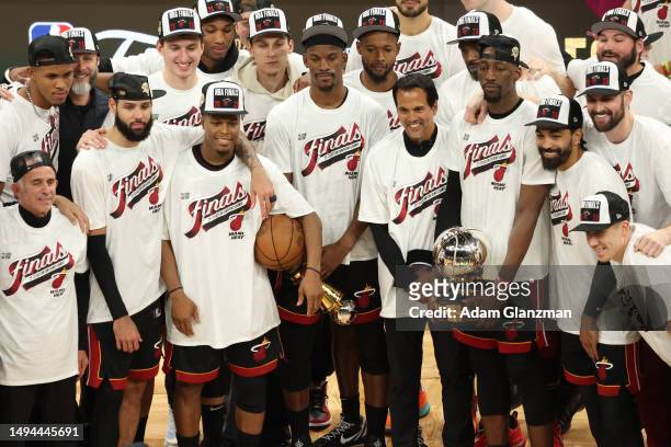 The Miami Heat pose with the Bob Cousy Trophy after defeating the Boston Celtics 103-84 in game seven of the Eastern Conference Finals at TD Garden...